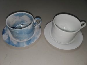 Custom printed cups and saucers before and after printing inside cups as well